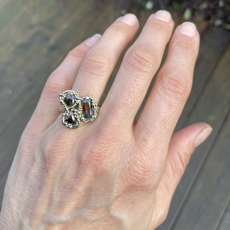 Gold ring with three brown sapphires