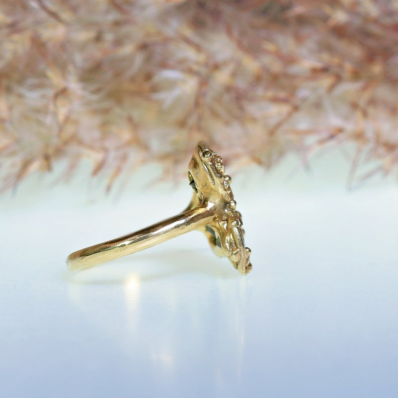 Gold ring with three brown sapphires