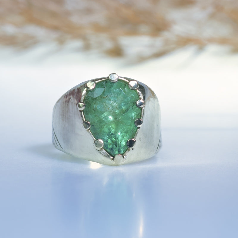 Statement gold ring with big emerald and hand carved band