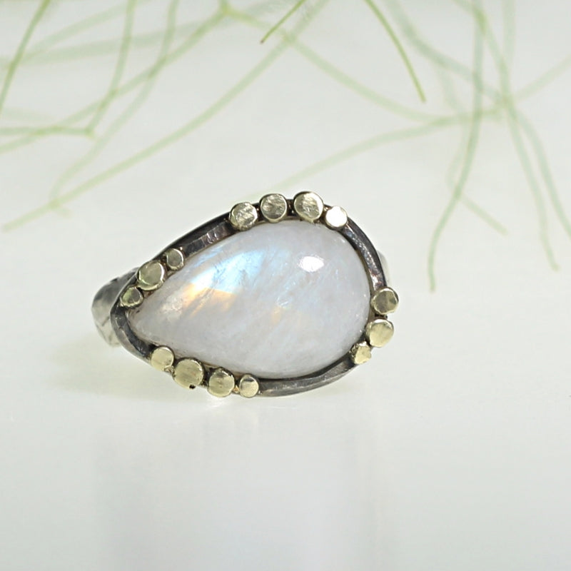 Ring with rainbow moonstone and gold dots