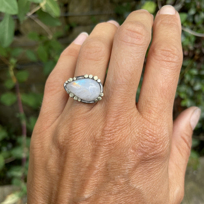 Ring with rainbow moonstone and gold dots