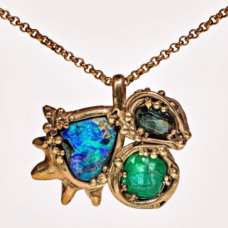 White gold necklace with opal, sapphire and emerald