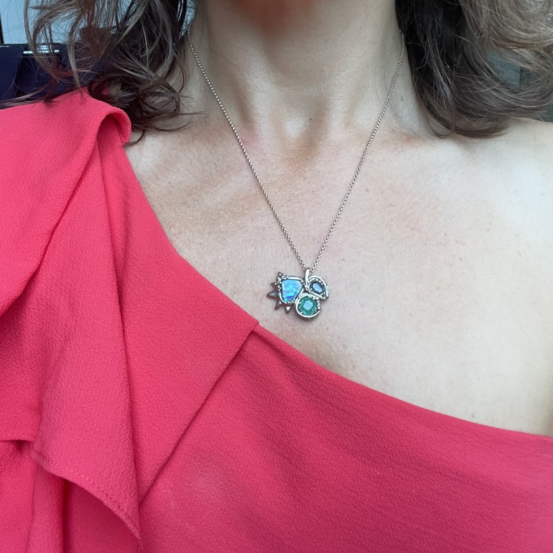 White gold necklace with opal, sapphire and emerald