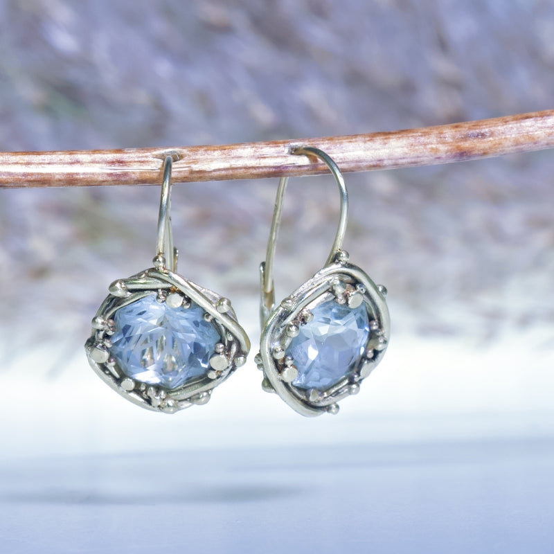 Gold earrings with mandala cut aquamarines