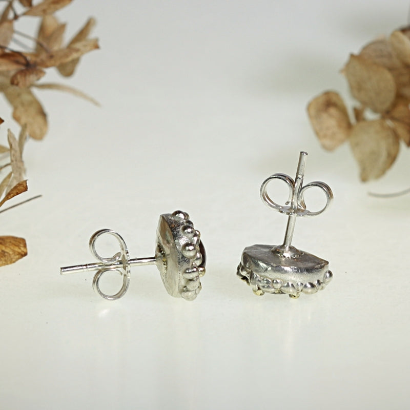 Stud earrings with oval rhodolite garnet