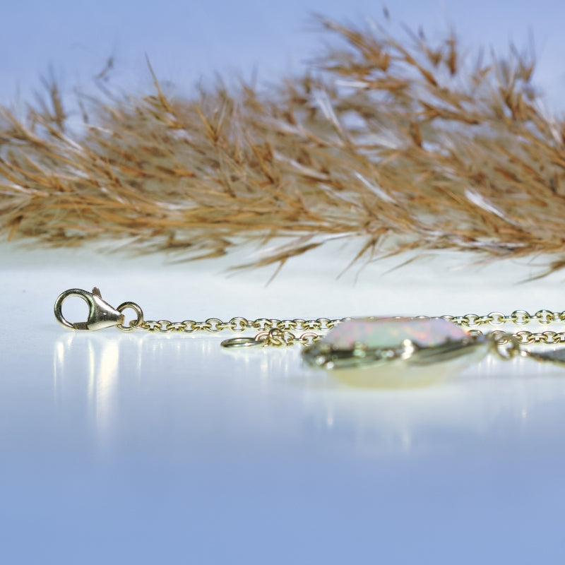 Gold necklace with big opal and heart