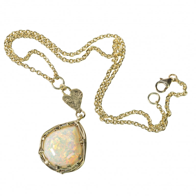 Gold necklace with big opal and heart