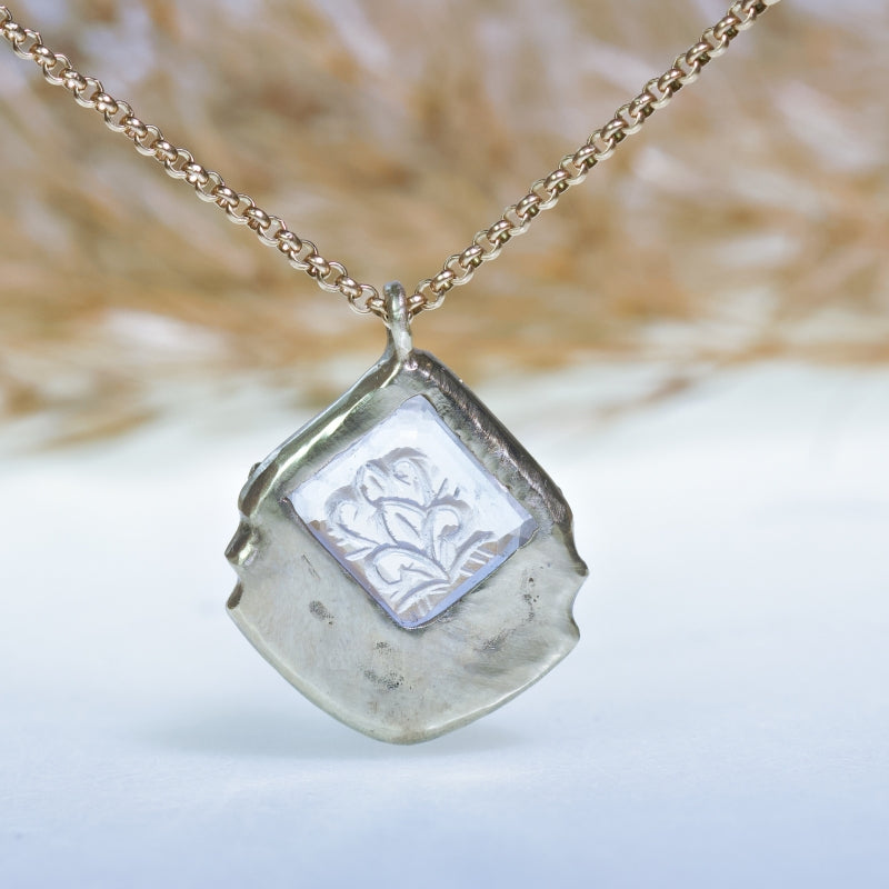 White gold necklace with handcarved morganite
