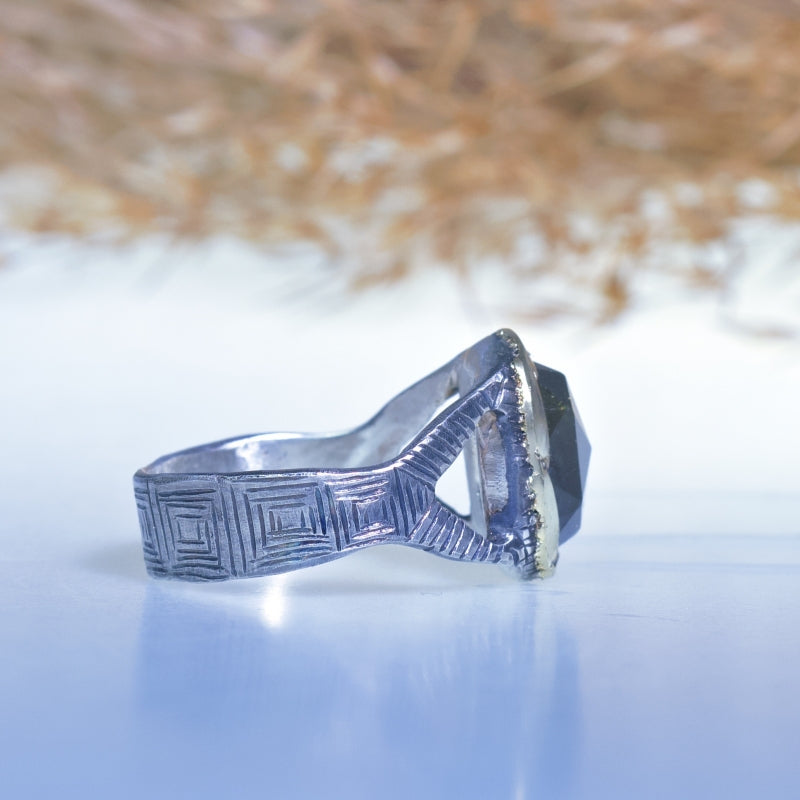 Ring with sphene/titanite and hand engraved band