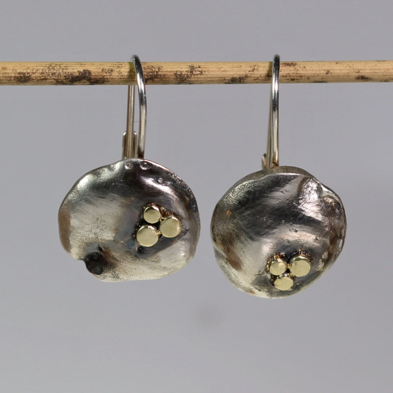 Round simply metals earrings with three gold dots