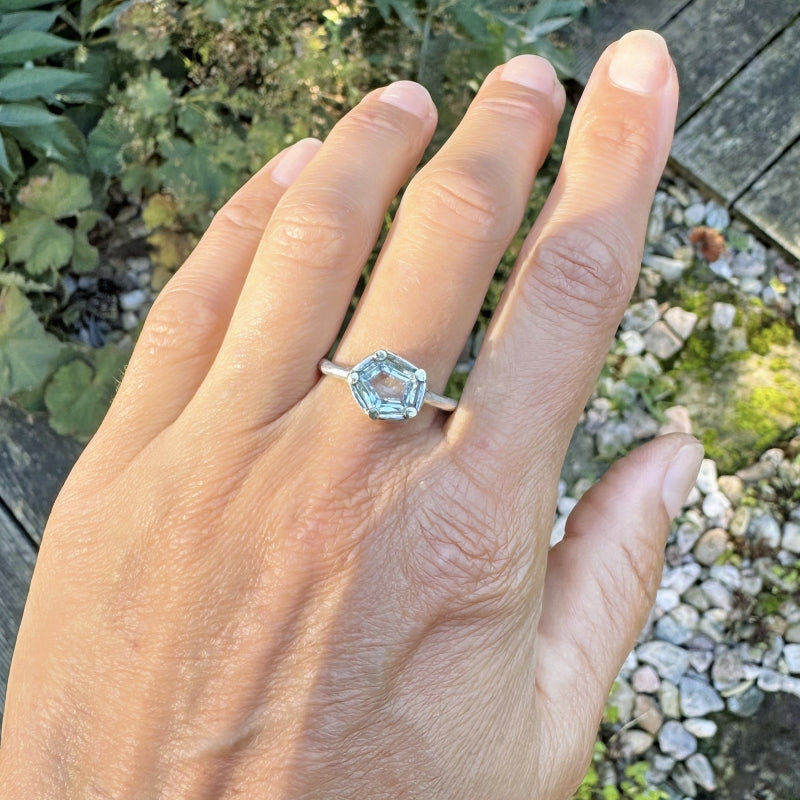 Tiny ring with geometric cut aquamarine