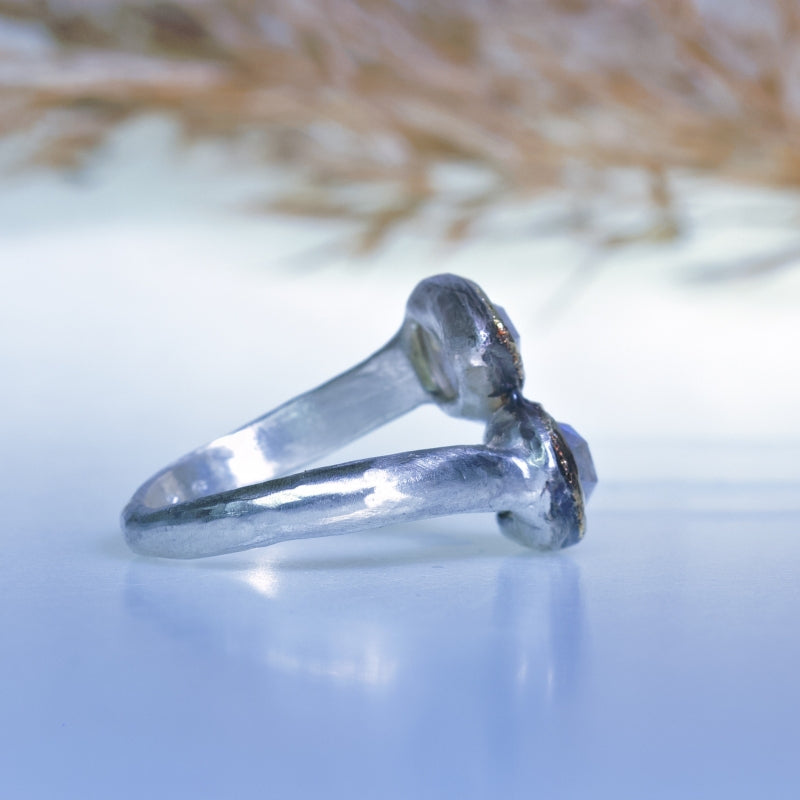 Ring with two pear shape moonstones