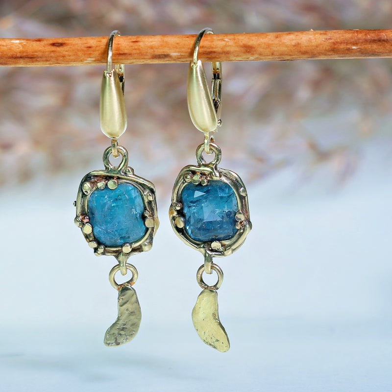 Gold earrings with sky blue tourmalines