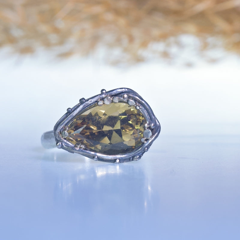 Ring with east-west pear shape precision cut citrine