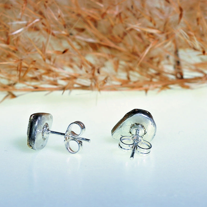Stud earrings with green geo cut tourmalines