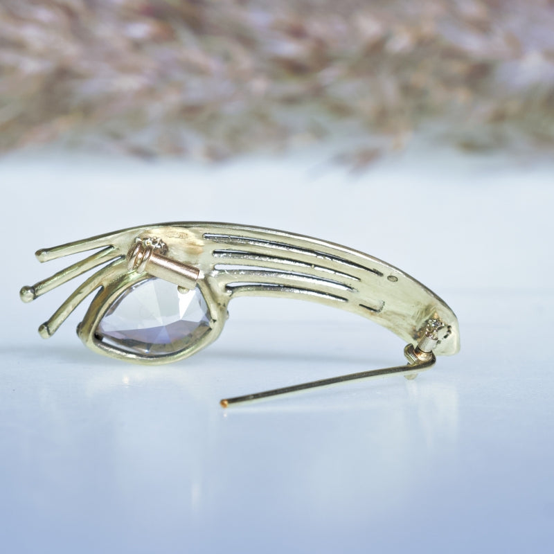 Gold brooch with danburite
