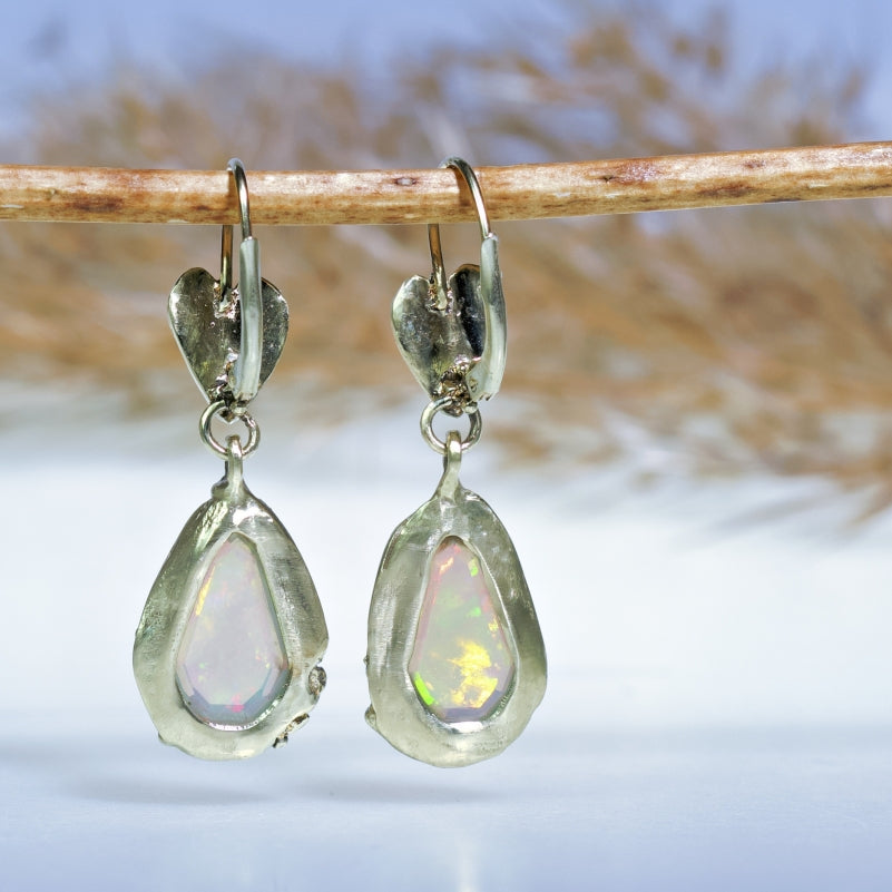 Gold earrings with opals and hearts