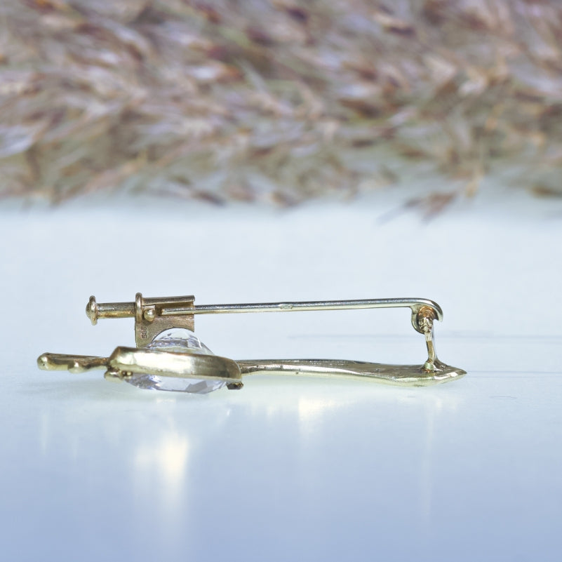 Gold brooch with danburite