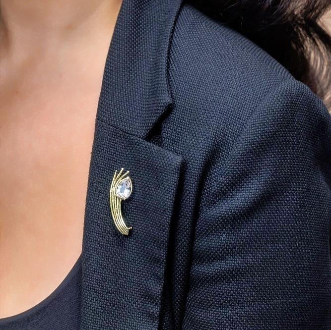Gold brooch with danburite