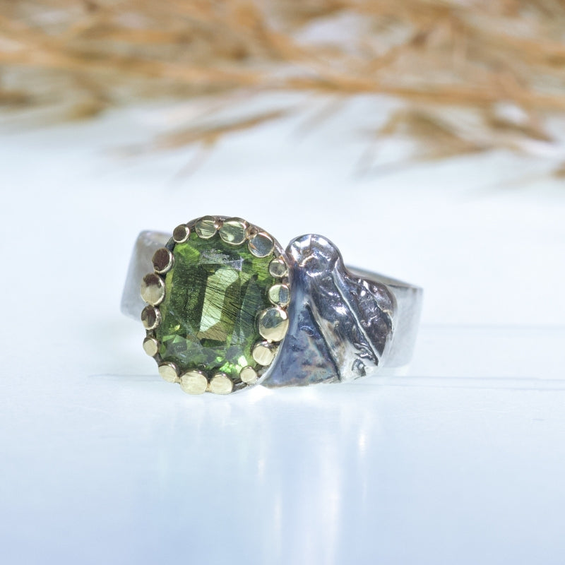 Ring with rutile peridot and silver heart