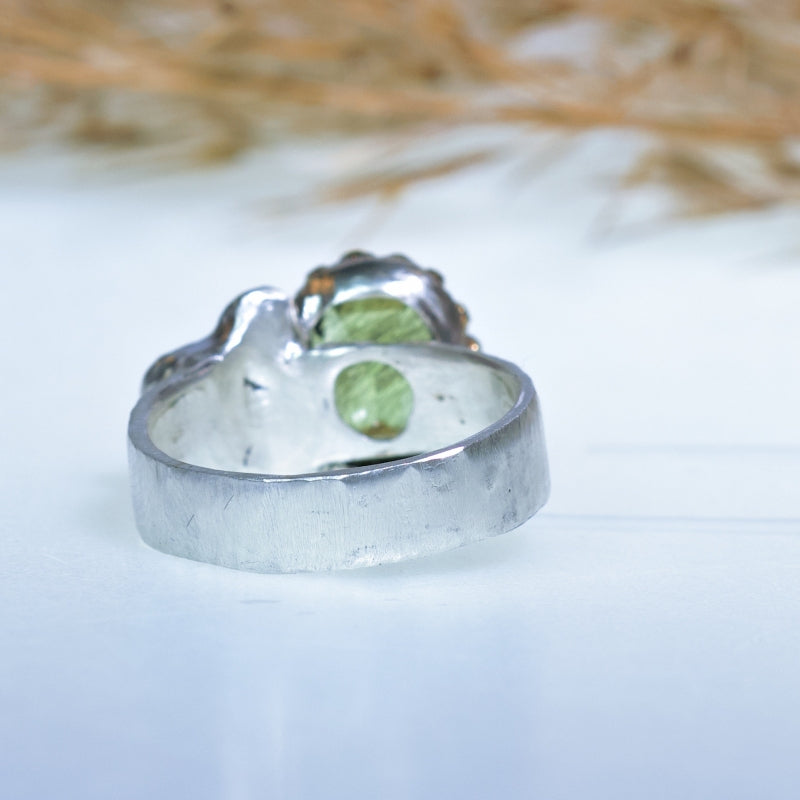 Ring with rutile peridot and silver heart