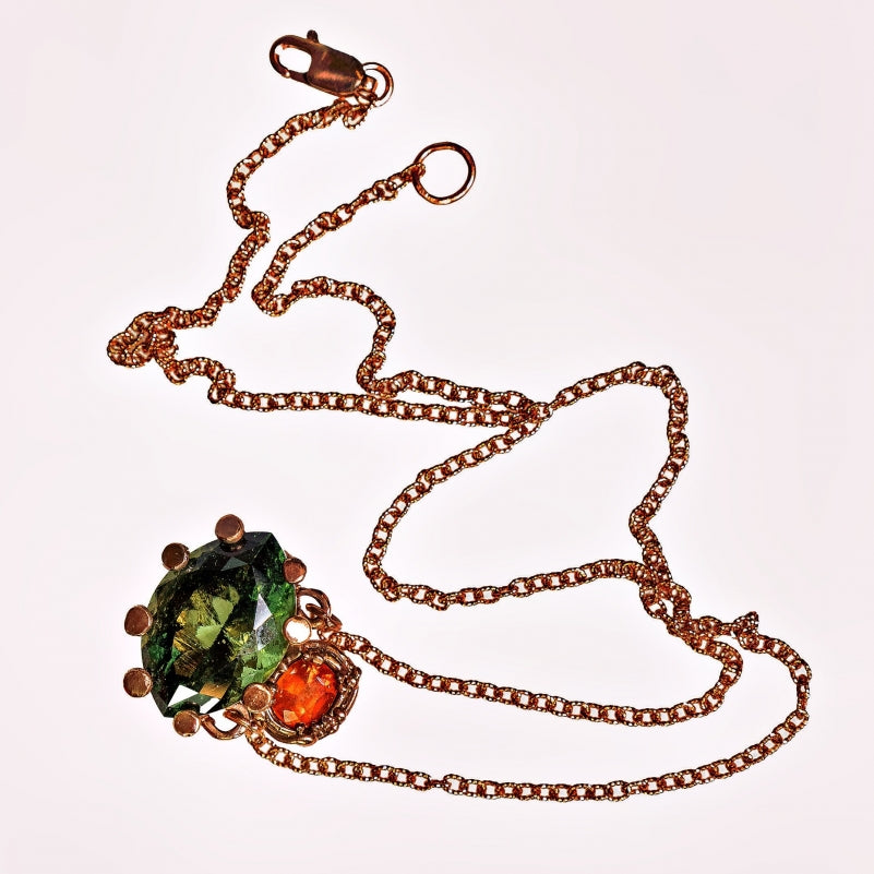 Gold necklace with moldavit and orange Umba sapphire