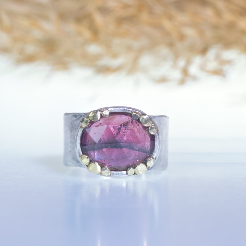 Ring with pink oval tourmaline and wide band