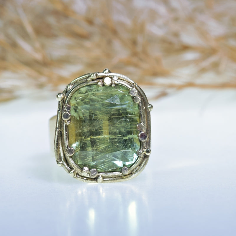 Statement gold ring with pale green tourmaline