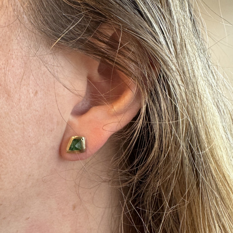 Stud earrings with tsavorite garnets