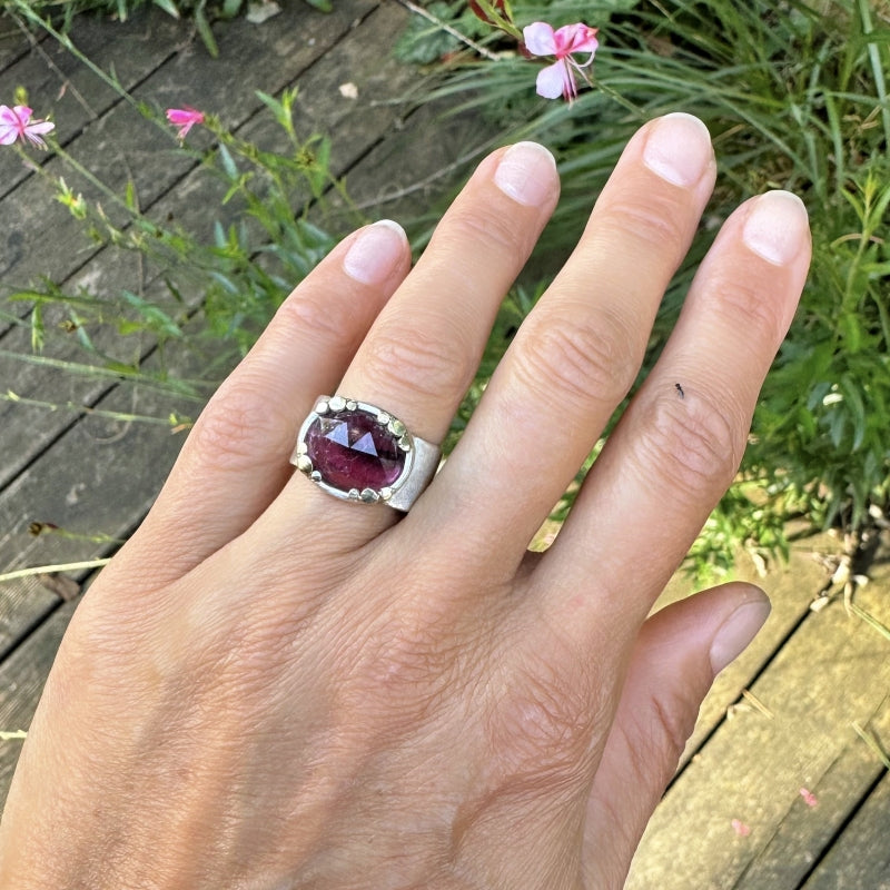 Ring with pink oval tourmaline and wide band