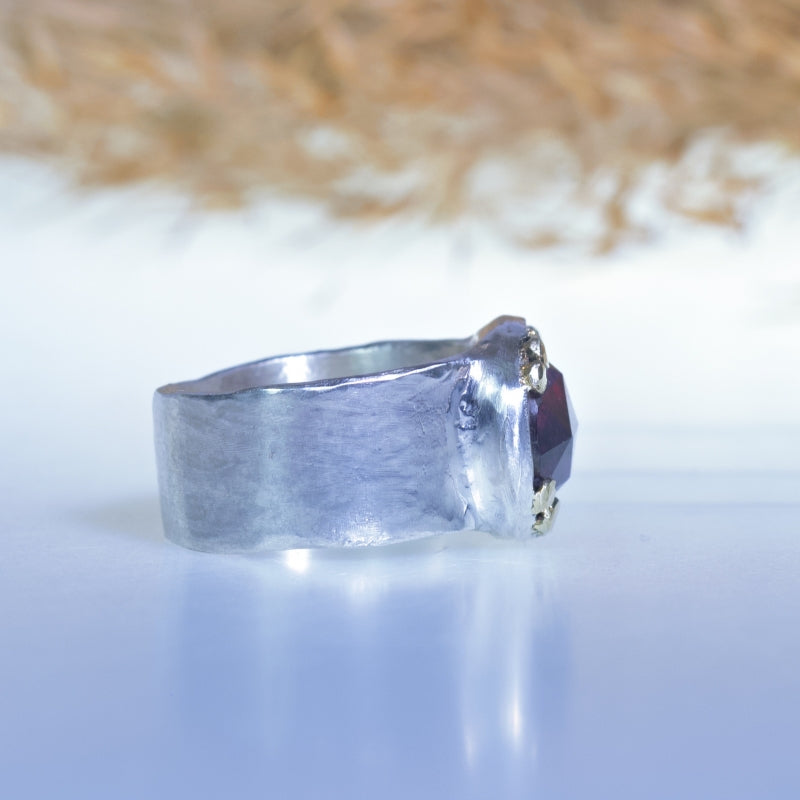 Ring with pink oval tourmaline and wide band