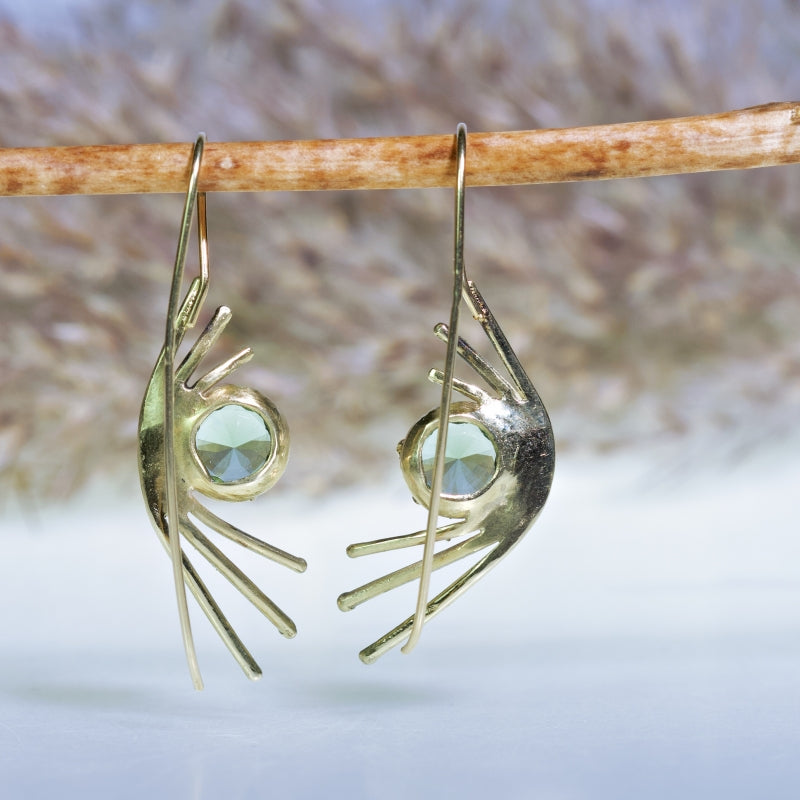 Gold extravagant earrings with moldavites
