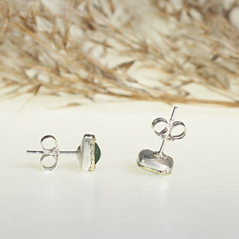 Stud earrings with tsavorite garnets