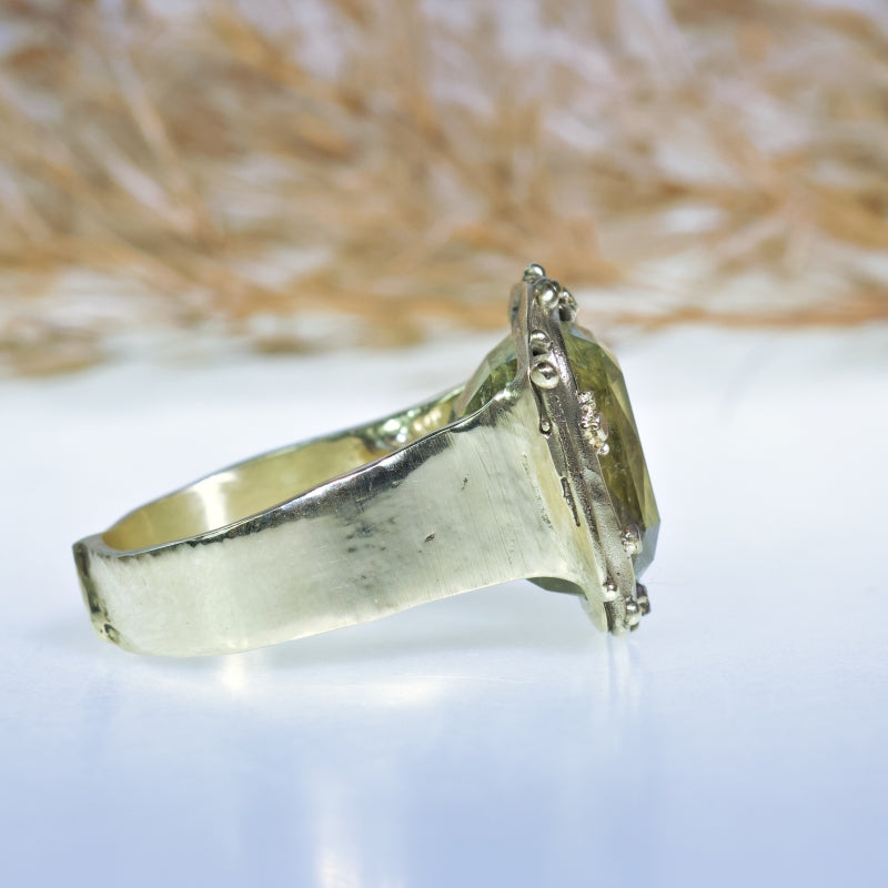 Statement gold ring with pale green tourmaline