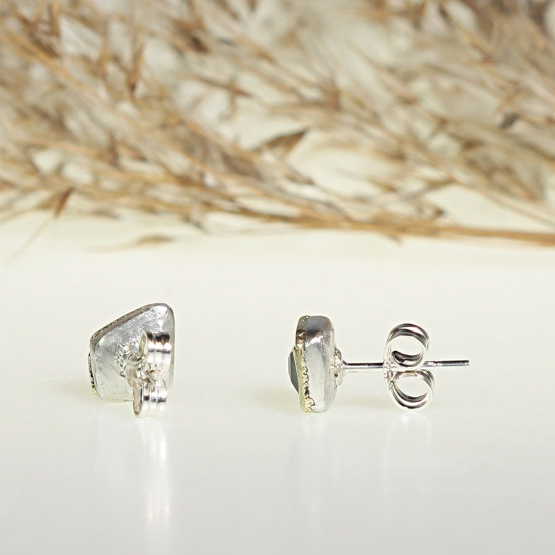Stud earrings with tsavorite garnets