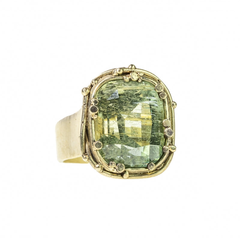 Statement gold ring with pale green tourmaline
