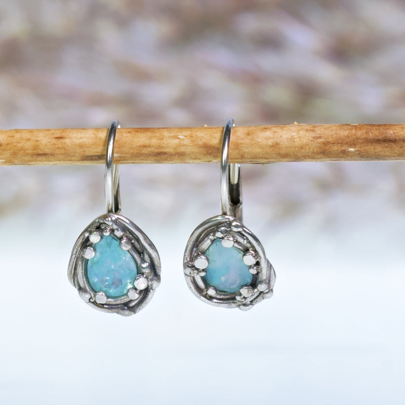 White gold earrings with gem silica