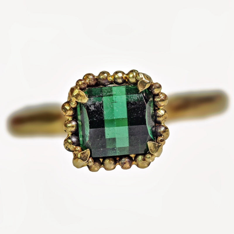 Gold ring with pixel cut tourmaline and halo