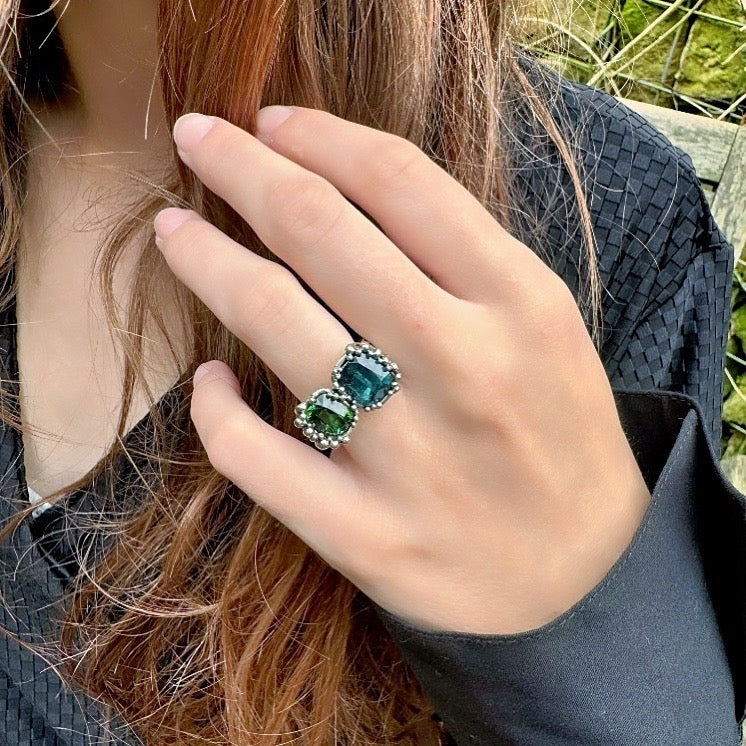 White Galaxy gold ring with two tourmalines