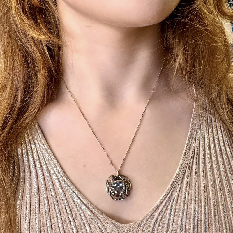 White gold necklace with round topaz