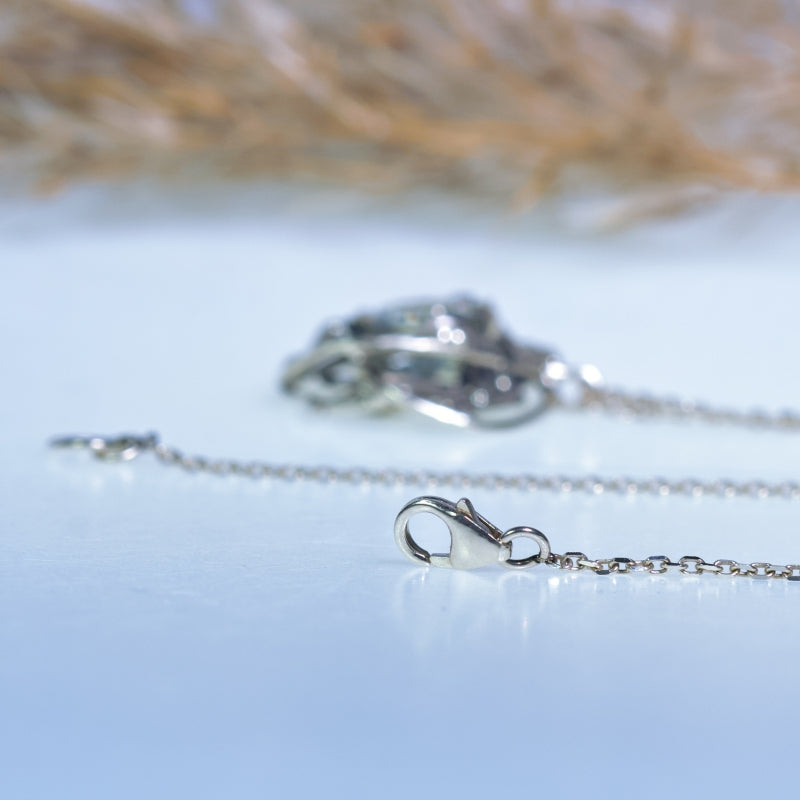 White gold necklace with round topaz