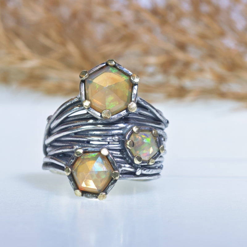 Wide Galaxy ring with three Ethiopian opals