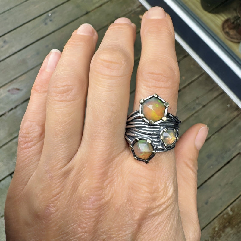 Wide Galaxy ring with three Ethiopian opals
