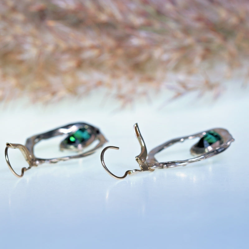 White gold earrings with blue-green tourmaline