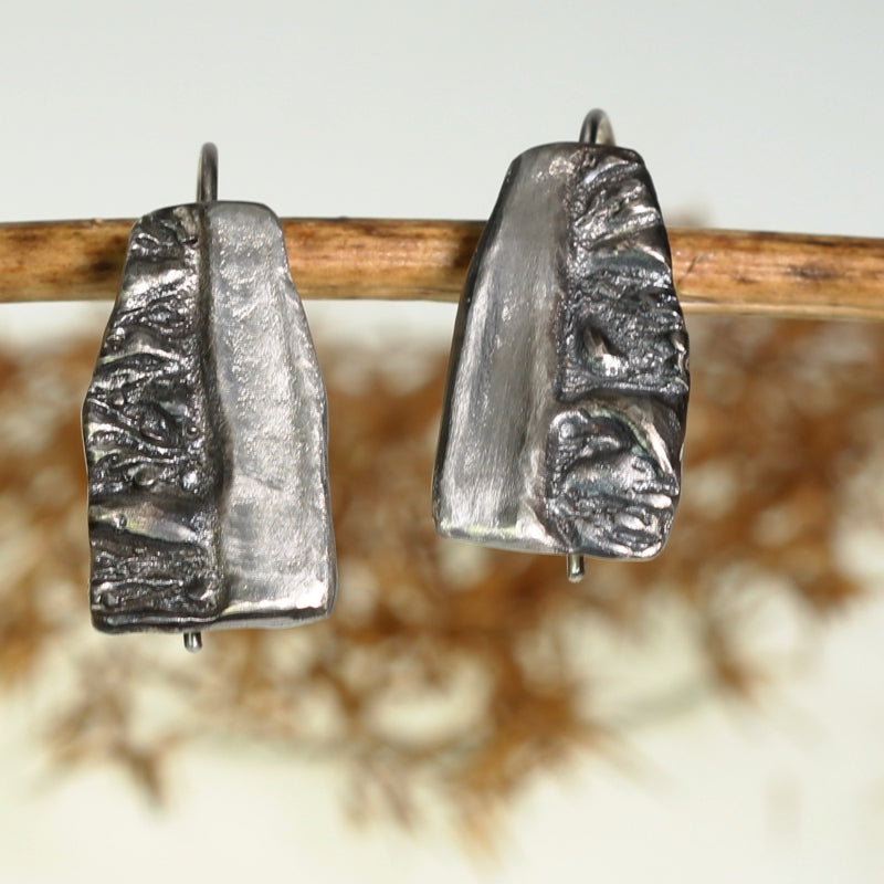 Hanging earrigns Earth and Sun