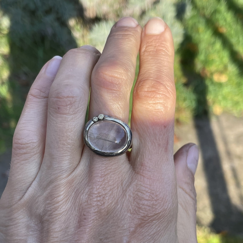 Ring with east-west setting gold rutile