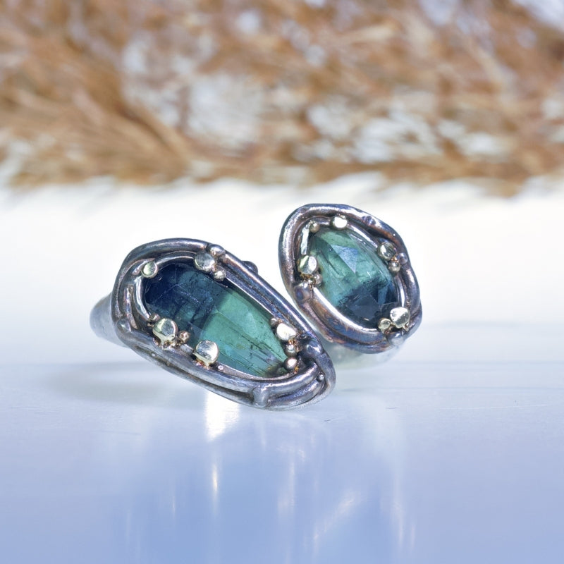 Open shape ring with two teal tourmalines