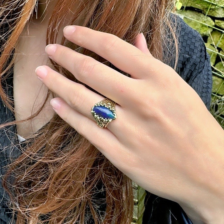 Gold ring Galaxy with dark blue opal