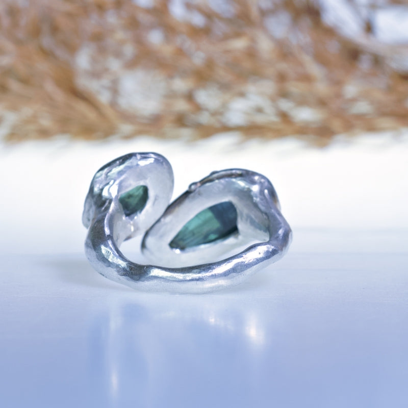 Open shape ring with two teal tourmalines