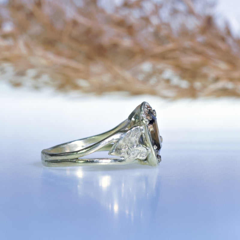 Gold ring with brown zircon and hearts